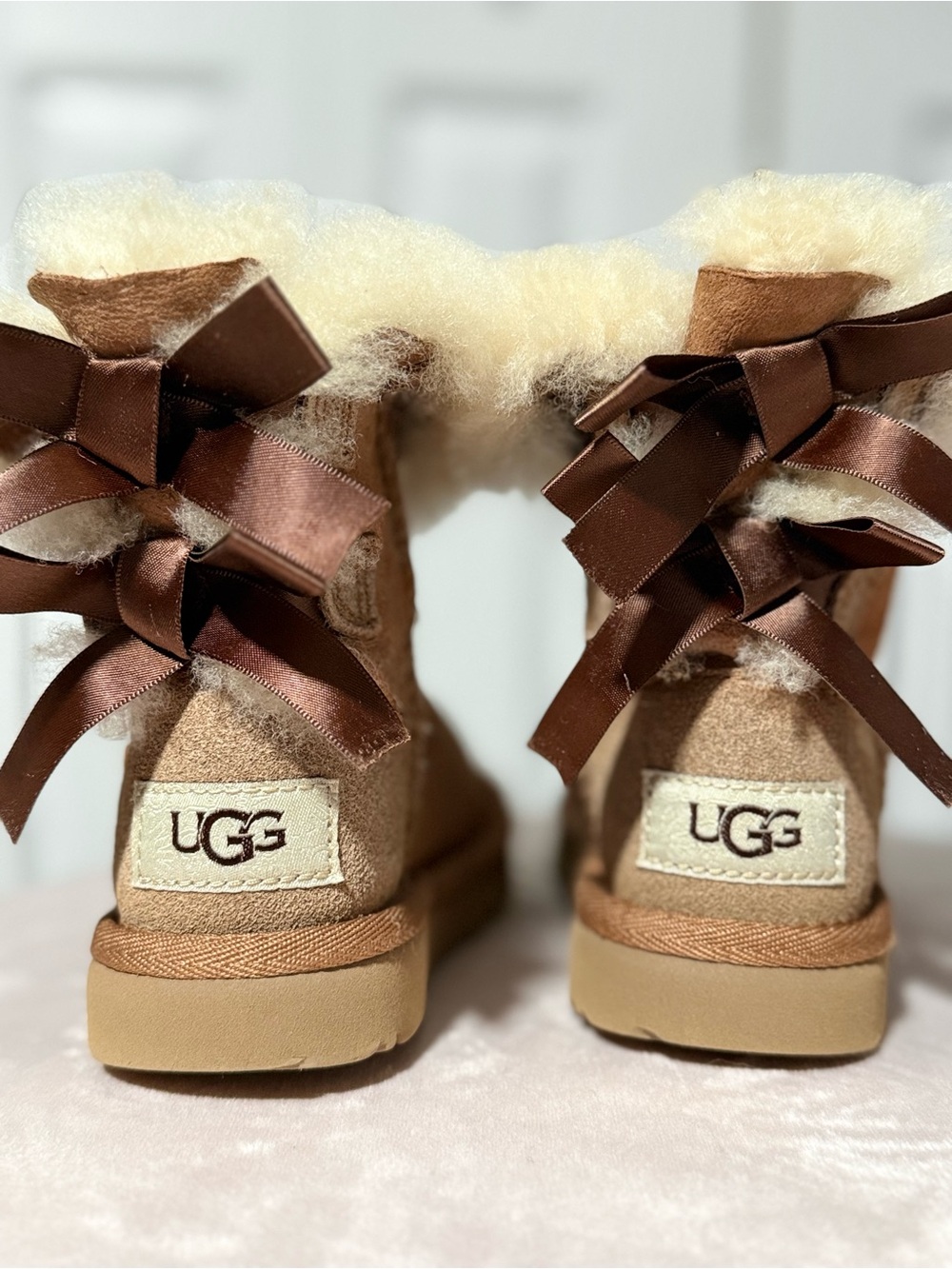 UGG Women's Bailey Bow Boot in Chestnut with Ivory Shearling